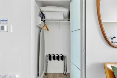 a bathroom with a mirror and a walk in closet at MVR-Sunset Luxury You Can-t Find Anywhere Else in Miami