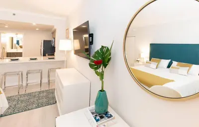 a white room with a bed and a mirror at MVR-Wake Up to Biscayne Bay Views Every Morning in Miami
