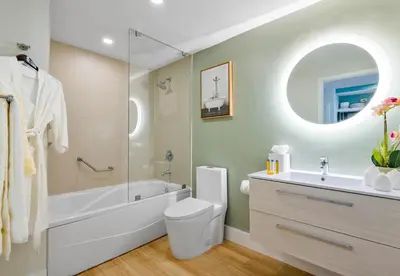 a bathroom with a tub and a toilet and a sink at MVR - Experience Coconut Grove Without Compromise in Miami