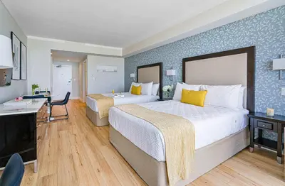 a hotel room with two beds and a desk at MVR - Experience Coconut Grove Without Compromise in Miami