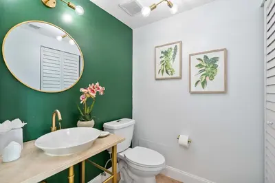 a bathroom with a white sink and a mirror at MVR - Elevate Your Stay with Stunning Ocean Views in Miami