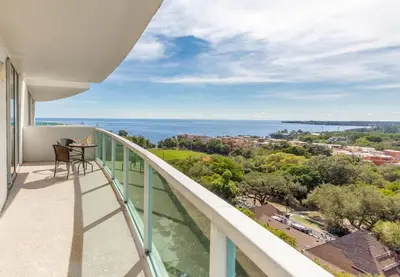 a balcony with a view of the ocean at MVR-Stop Searching-This Stay Has It All in Miami