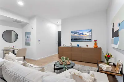 a living room with a couch and a table at MVR - Sunset & Skyline Magic from Your Balcony in Miami