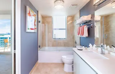 a bathroom with a tub and a toilet and a sink at MVR - Miami's Most Exclusive Stay-Revealed in Miami