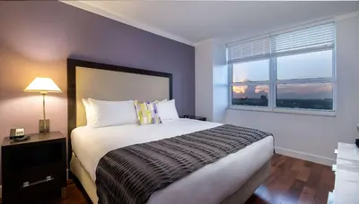 a bedroom with a large bed and a window at MVR - Stay Near Brickell Without the Hassle in Miami