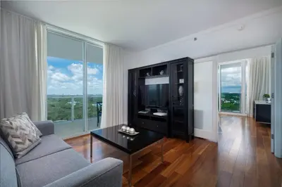 a living room with a couch and a tv at MVR - Stay Near Brickell Without the Hassle in Miami
