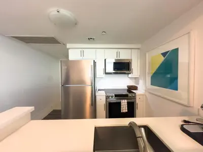 a kitchen with a stainless steel refrigerator and microwave at MVR - Act Fast-Grove-s Best Stays Don-t Last in Miami
