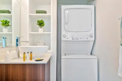a white refrigerator in a bathroom with a sink at MVR - Skyline Dreams from Your Private Balcony in Miami