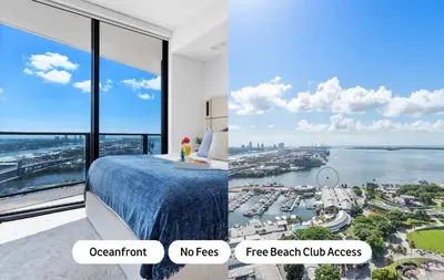 a bedroom with a view of a harbor at MVR - Swim Relax & Enjoy Jaw-Dropping Views in Miami