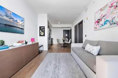 a living room with a couch and a table at MVR - 5-Star Resort Pool & Private Balcony in Miami