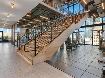 a spiral staircase in a building with a lobby at MVR - Designer Apt with Jaw-Dropping Views & Pool in Miami