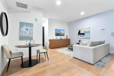 a living room with a white couch and a table at MVR - SupErhost Stay 10 Yrs of 5-Star Service in Miami