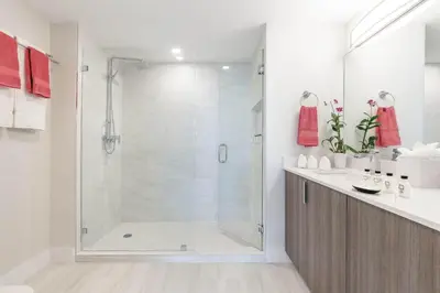 a bathroom with a shower with a glass door at MVR Suite-A Stay That Feels Like a Private Resort in Miami