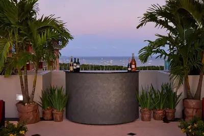 a bar with bottles of wine on top of a building at MVR - A Suite That-s Actually as Good as It Looks in Miami