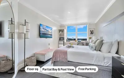 a white bedroom with a large bed and a window at MVR - This Miami Suite Is Built to Impress in Miami