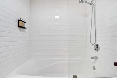 a white bathroom with a tub and a shower at MVR Designer Suite with Balcony and Miami-s Best Views in Miami