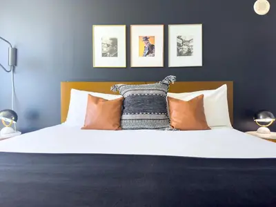 a bedroom with a large bed with orange pillows at MVR King Suite Room Bay View in Miami