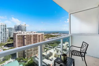 a balcony with a chair and a view of the city at MVR Coconut Grove Suite You will want to Keep Secret in Miami