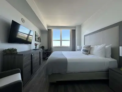 a hotel room with a bed and a television at MVR Suite Boutique Living with Big Luxury Energy in Miami