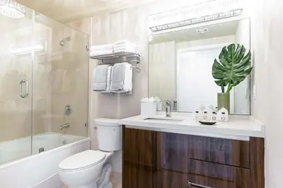 a bathroom with a sink and a toilet and a shower at MVR A 5-Star Suite Feel Without Leaving the Grove in Miami