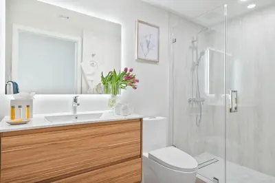 a bathroom with a toilet and a sink and a shower at MVR Suite The Secret to Luxury Living Is Right Here in Miami
