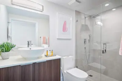 a bathroom with a sink and a toilet and a shower at MVR Biscayne Bay Views That Stun Daily in Miami
