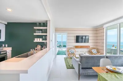 a kitchen and living room with a couch and a table at MVR Biscayne Bay Views That Stun Daily in Miami