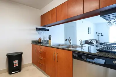 a kitchen with a sink and a counter top at Spacious Penthouse in Brickell 3 BR, Free Parking in Miami