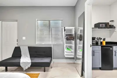 a kitchen with a refrigerator with its door open at Comfy Studio W Beautiful Space! in Miami