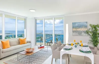 a living room with a couch and a table at MVR Unforgettable Balconies Await You in Miami