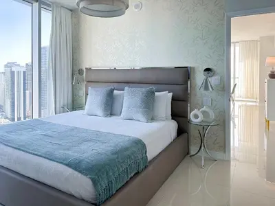 a bedroom with a large bed and a large window at MVR An Unforgettable View Awaits You in Miami
