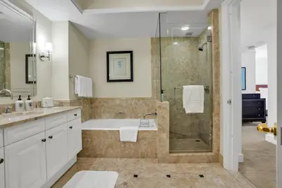 a bathroom with a shower and a sink and a tub at Four Seasons Miami Two Bedroom - 2Bath Ocean view Suite - Amazing views in Miami