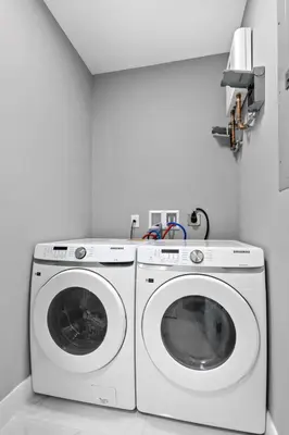 a white washer and dryer in a white room at Amazing Townhouse w Free Parking in Miami