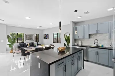 a kitchen and living room with a dining room at Amazing Townhouse w Free Parking in Miami