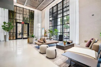 a large living room with couches and tables and windows at MVR Skyline Luxury in Downtown Miami in Miami