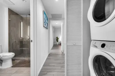 a laundry room with a washer and dryer in a bathroom at Best Location 2 bedrooms 2 bathrooms in Miami