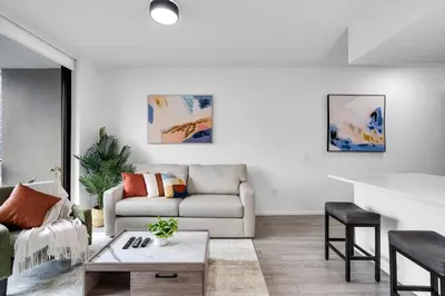 a living room with a couch and a table at Best Location 2 bedrooms 2 bathrooms in Miami