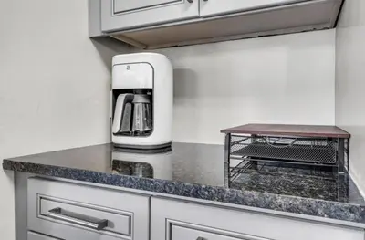 a kitchen with a coffee maker on a counter at 4BR Biscayne River Home- Pool & Pickleball Fun home in Miami