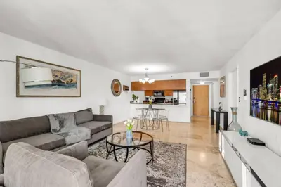 a living room with a couch and a table at Stylish 1BR Brickell Retreat Walk to Everything in Miami