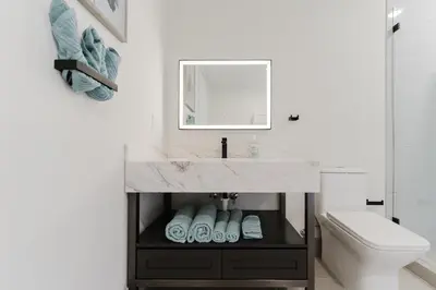 a bathroom with a sink and a mirror at Miami apartment style - Casino & Restaurants in Fort Lauderdale