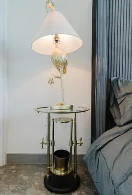 a lamp sitting on a table next to a bed at Miami apartment style - Casino & Restaurants in Fort Lauderdale