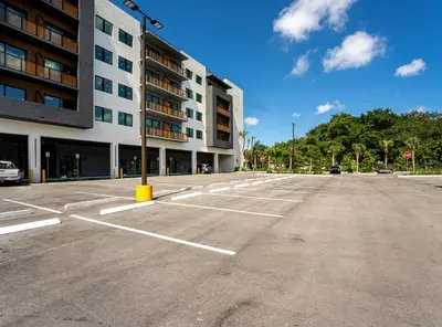 an empty parking lot in front of a building at Miami apartment style - Casino & Restaurants in Fort Lauderdale