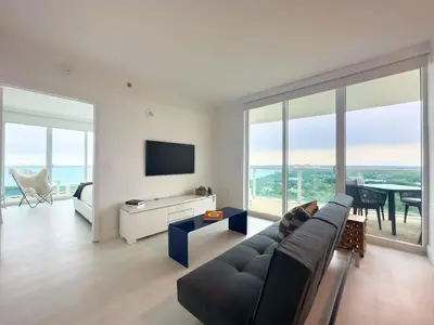 a living room with a couch and a tv at Miami top stay is nearly sold in Miami