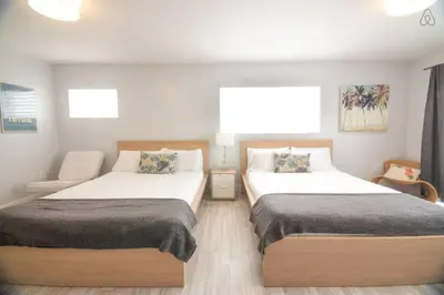 a bedroom with two beds and a couch at Ocean Drive Studio Roof top Pool and Bar in Miami Beach