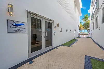 a white building with a sign on the side of it at Ocean Drive Studio Roof top Pool and Bar in Miami Beach