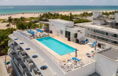 an aerial view of a resort with a swimming pool and the beach at Ocean Drive Studio Roof top Pool and Bar in Miami Beach