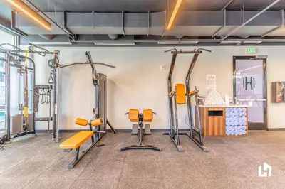 a gym with several treadmills and exercise equipment at Downtown Vibes Pool Gym & Oceanview in Miami
