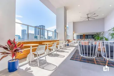 a restaurant with chairs and tables and a view of the city at Downtown Vibes Pool Gym & Oceanview in Miami