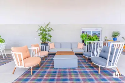 a living room with a couch and chairs at Downtown Vibes Pool Gym & Oceanview in Miami