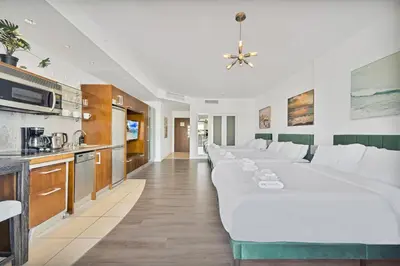 a living room with a large white couch in a room at Stylish Studio in South Beach with Ocean Views in Miami Beach